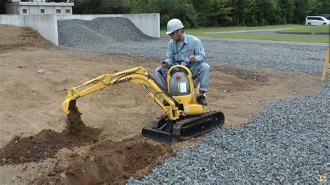 small digger|smallest excavator in the world.